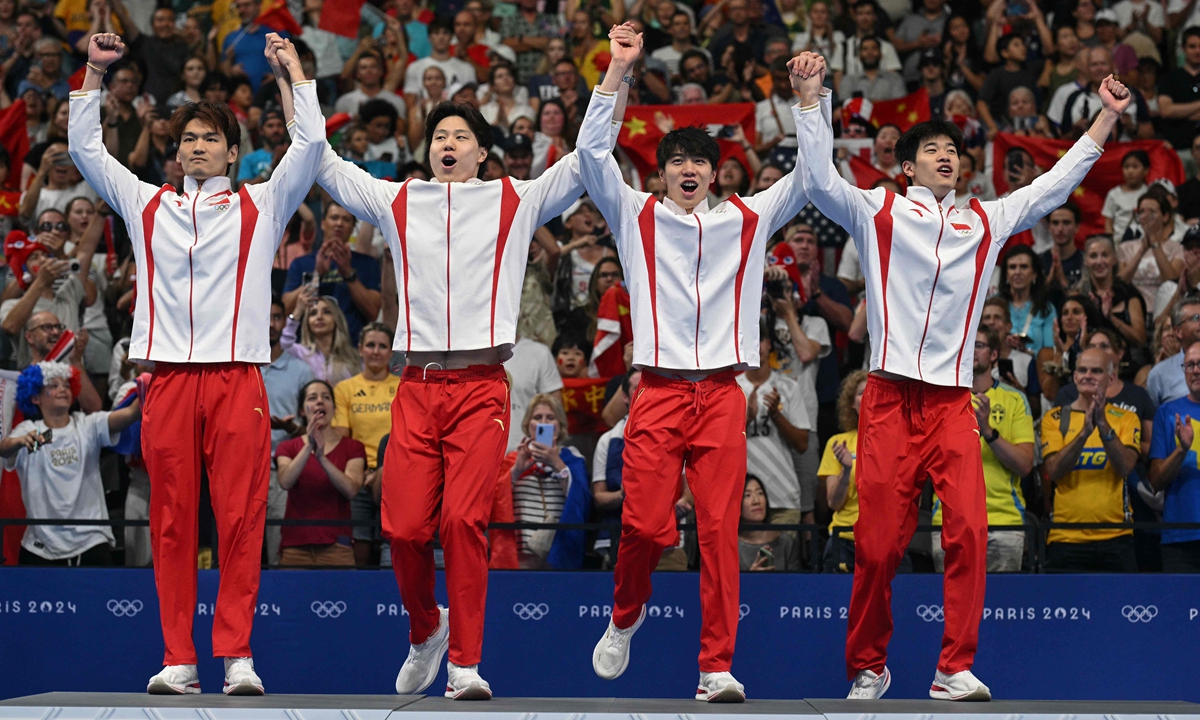 China's swiming team celebrates victory in the men's 4x100m medley relay final at the Paris Olympics in Paris on August 4, 2024. Photo: VCG