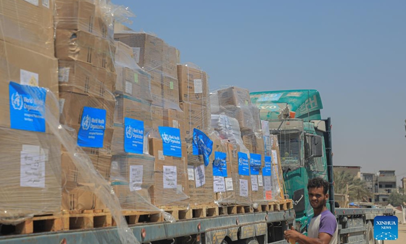 A man stands in front of a truck loaded with medical aid delivered by the World Health Organization (WHO) at Nasser Hospital in the southern Gaza Strip city of Khan Younis, on Aug. 7, 2024. A seemingly endless cycle of violence-induced displacement is making it increasingly difficult for Gazans to access the assistance they need, UN humanitarians said on Wednesday. (Photo: Xinhua)