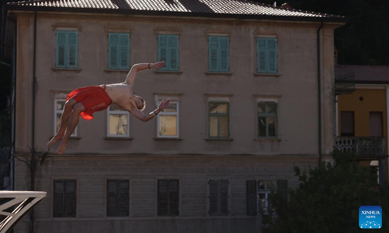 A participant jumps into the River Soca from a 17-meter-high bridge during the 33rd traditional jumping event in Kanal ob Soci, Slovenia on Aug. 11, 2024. Photo: Xinhua