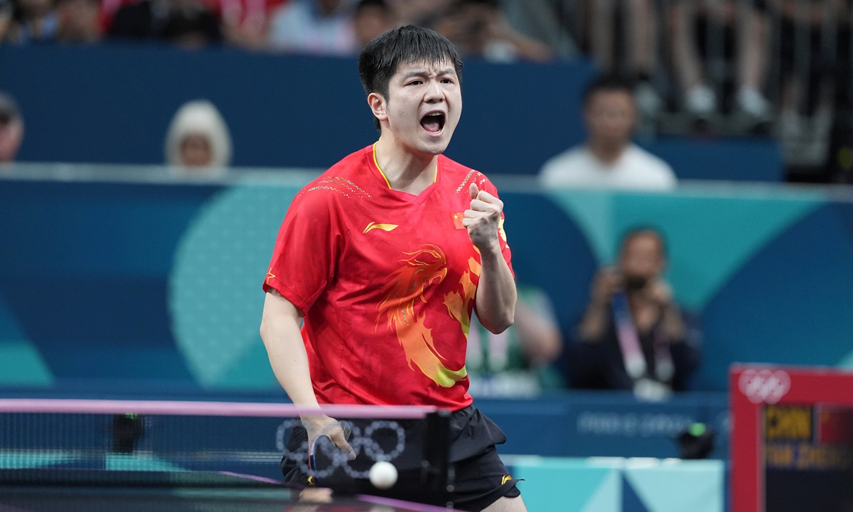 Chinese paddler Fan Zhendong celebrates after winning the table tennis men's singles title in Paris on August 4, 2024. Photo: VCG