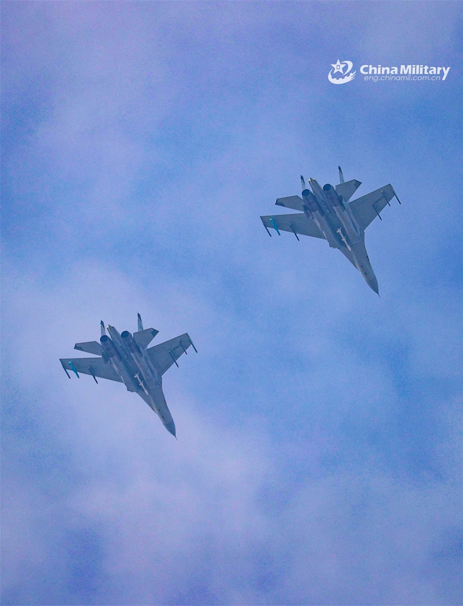 Fighter jets attached to a naval aviation unit under the PLA Southern Theater Command fly in formation during a multi-subject flight training exercise on June 13, 2024. (eng.chinamil.com.cn/Photo by Fu Jinquan)