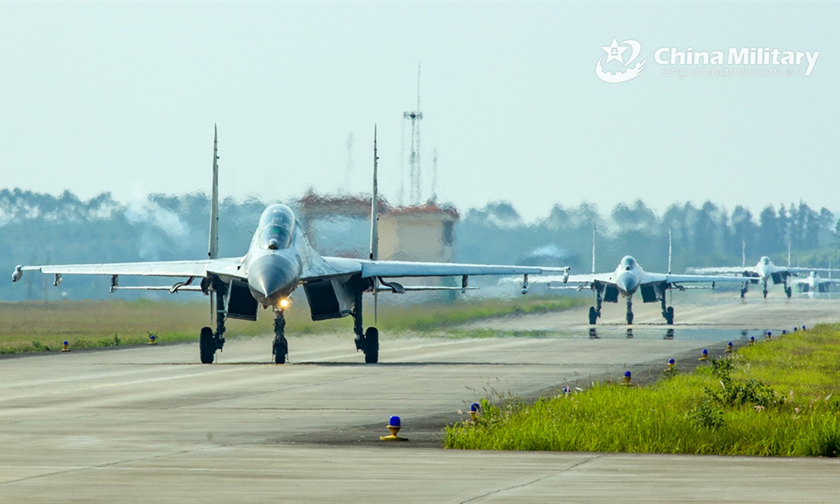 Fighter jets attached to a naval aviation unit under the PLA Southern Theater Command taxi on the flightline in formation during a multi-subject flight training exercise on June 13, 2024. (eng.chinamil.com.cn/Photo by Fu Jinquan)