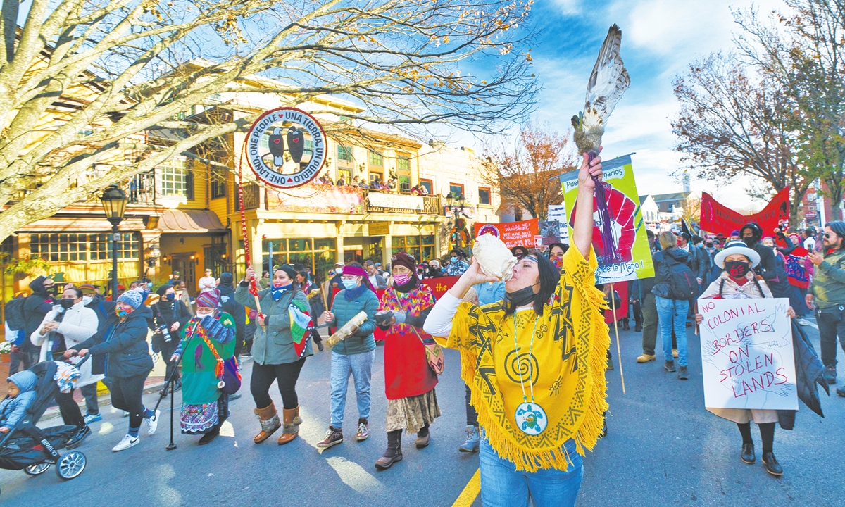 A group of over 1,<strong></strong>000, mostly native Americans, marched through the town of Plymouth, Massachusetts, to mourn the violent history behind Thanksgiving on November 25, 2021. Photo: VCG