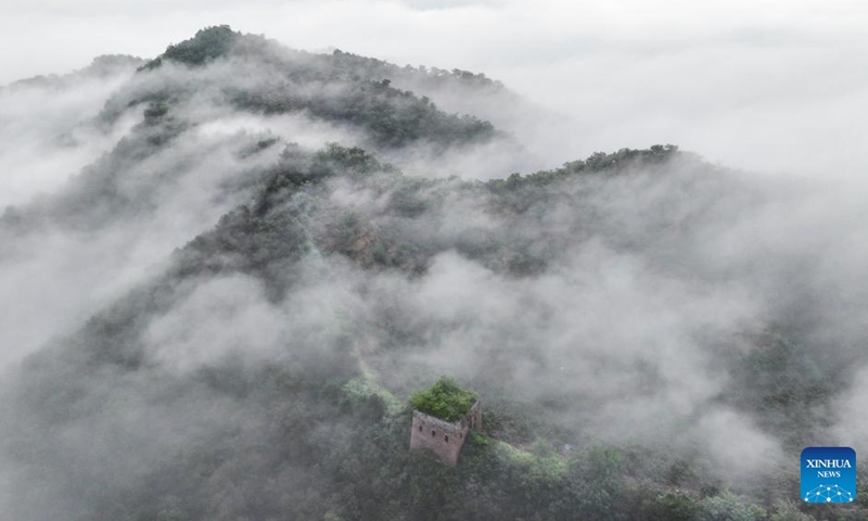 An aerial drone photo taken on Aug. 11, 2024 shows a section of the Great Wall shrouded in clouds in Xinglong County of Chengde City, north China's Hebei Province. Photo: Xinhua