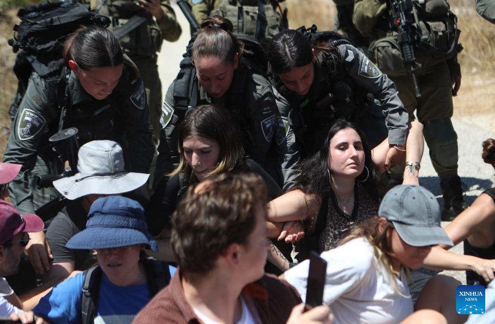 Israeli soldiers detain Palestinians and foreign activists during a demonstration against the Israeli confiscation of land in Beit Jala, near the West Bank city of Bethlehem, on Aug. 8, 2024. (Photo: Xinhua)