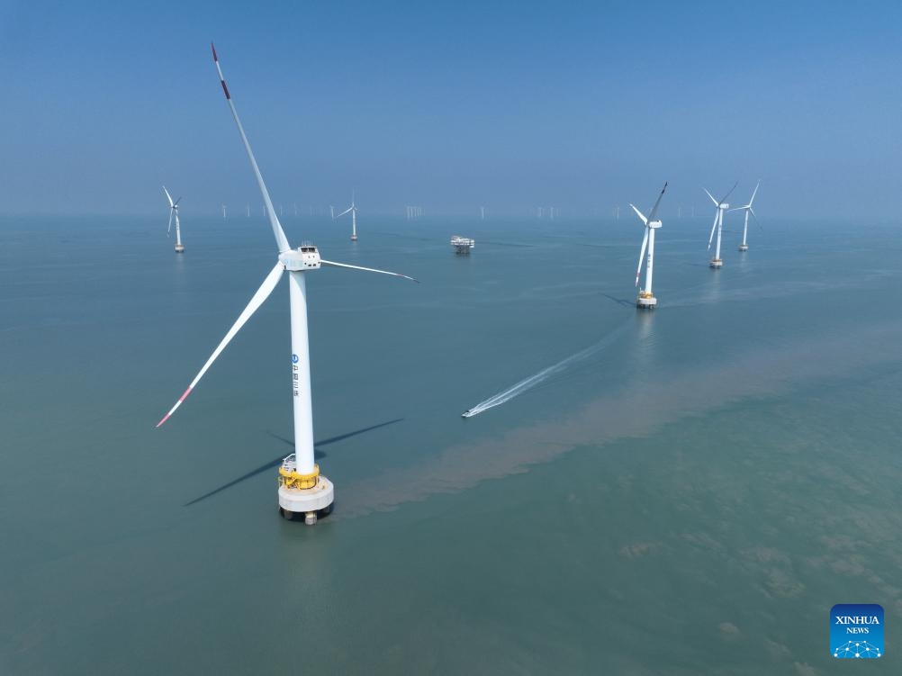 An aerial drone photo taken on Aug. 8, 2024 shows the Xinghua Bay pilot wind farm where some offshore wind turbines independently produced in Fujian Three Gorges Offshore Wind Power International Industrial Park are installed in Fuqing City, southeast China's Fujian Province. The industrial park, with a total investment of 4 billion yuan (about 557.7 million U.S. dollars), is the first full-industry-chain offshore wind power industrial park in China. (Photo: Xinhua)