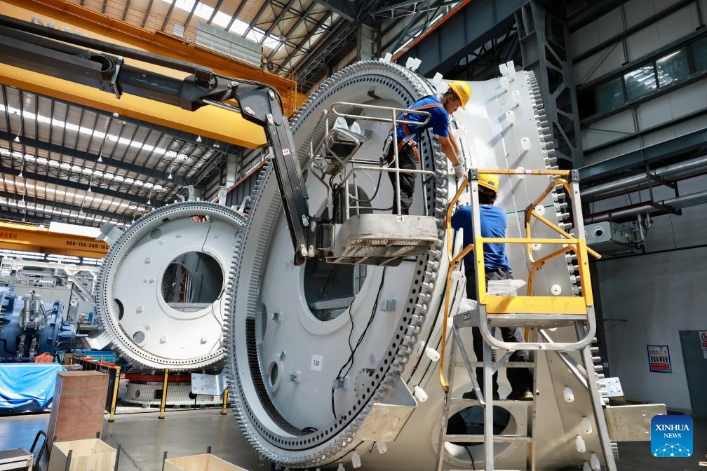 Workers of Dongfang Electric Wind Power Co., Ltd. produce offshore wind turbines of 18-megawatt at the Fujian Three Gorges Offshore Wind Power International Industrial Park in Fuqing City, southeast China's Fujian Province, Aug. 8, 2024. The industrial park, with a total investment of 4 billion yuan (about 557.7 million U.S. dollars), is the first full-industry-chain offshore wind power industrial park in China. (Photo: Xinhua)