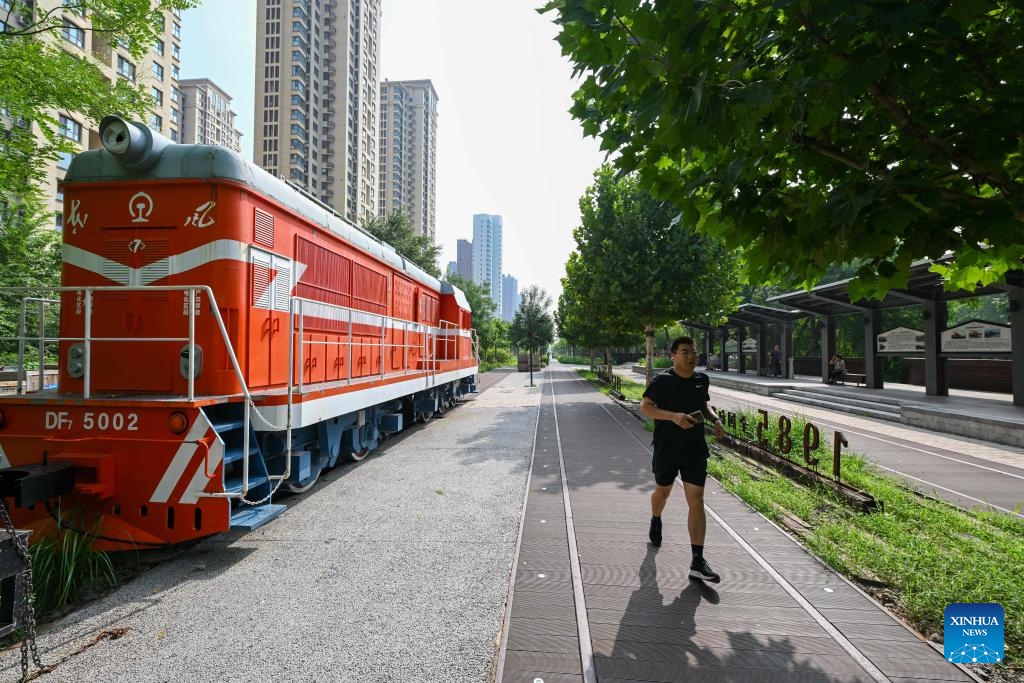 A man takes a run at a city park in north China's Tianjin Municipality, Aug. 8, 2024. August 8, the opening day of the Beijing Olympics, was designated as National Fitness Day in China, reflecting the growing integration of sports into everyday life. (Photo: Xinhua)