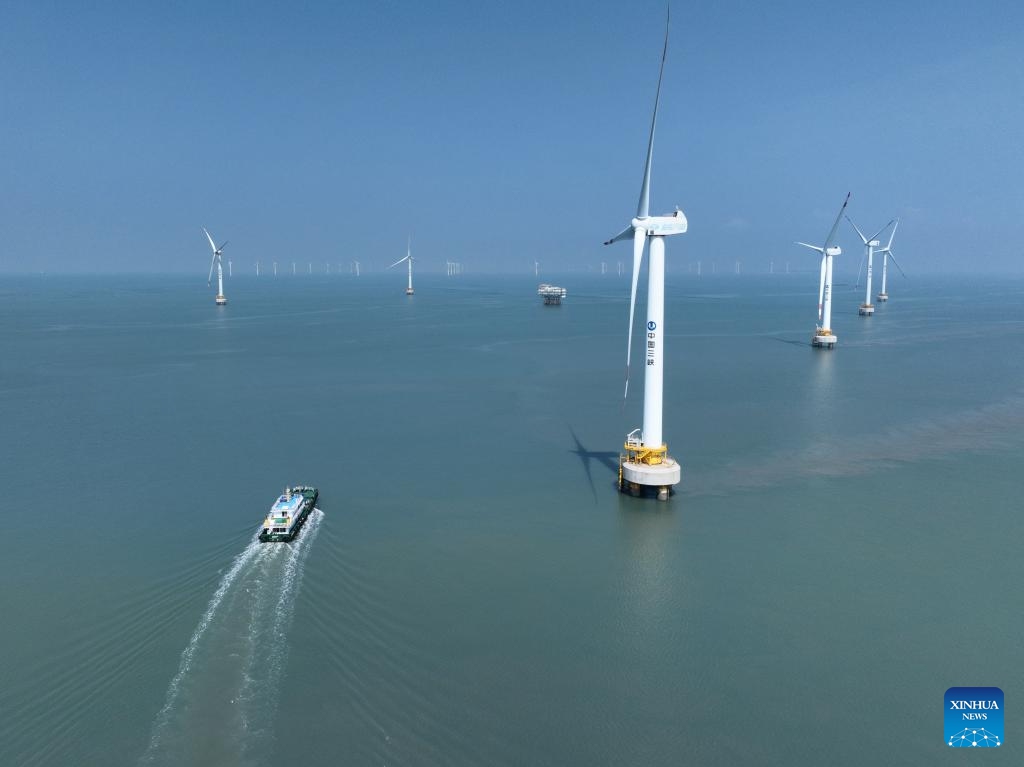 An aerial drone photo taken on Aug. 8, 2024 shows the Xinghua Bay pilot wind farm where some offshore wind turbines independently produced in Fujian Three Gorges Offshore Wind Power International Industrial Park are installed in Fuqing City, southeast China's Fujian Province. The industrial park, with a total investment of 4 billion yuan (about 557.7 million U.S. dollars), is the first full-industry-chain offshore wind power industrial park in China. (Photo: Xinhua)