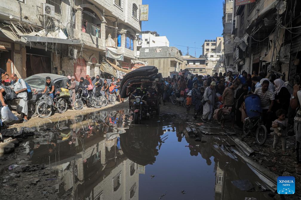 People flee from the eastern districts of the southern Gaza Strip city of Khan Younis, on Aug. 8, 2024. Following a new evacuation order issued by the Israeli authorities, UN humanitarians said on Thursday its partners reported thousands of Gazans again fleeing parts of the Khan Younis area, west, toward Al Mawasi. (Photo: Xinhua)