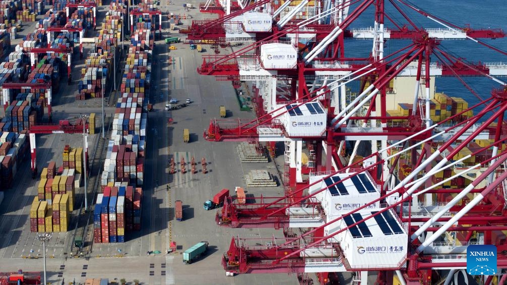 An aerial drone photo taken on Aug. 6, 2024 shows a view of Qingdao Port in east China's Shandong Province. In recent years, Shandong Province has leveraged its marine resources to promote the integrated reform and development of coastal ports, to create a world-class port group. (Photo: Xinhua)