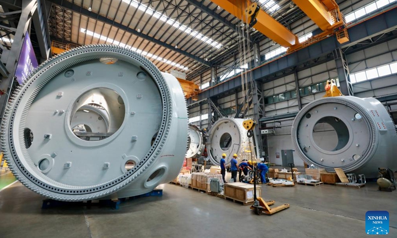 Workers of Dongfang Electric Wind Power Co., Ltd. produce offshore wind turbines of 18-megawatt at the Fujian Three Gorges Offshore Wind Power International Industrial Park in Fuqing City, southeast China's Fujian Province, Aug. 8, 2024. The industrial park, with a total investment of 4 billion yuan (about 557.7 million U.S. dollars), is the first full-industry-chain offshore wind power industrial park in China. (Photo: Xinhua)