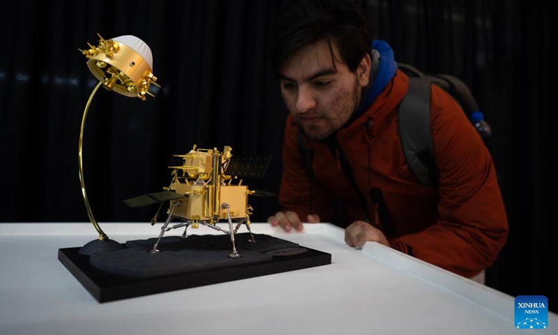 A man looks at a replica of the Chang'e-5 probe exhibited at the Chinese Aerospace Exhibition in the Art Center of the National University of La Plata in La Plata, Argentina, Aug. 8, 2024. The Chinese Aerospace Exhibition opened to the public from Aug. 7 to 10. Photo: Xinhua