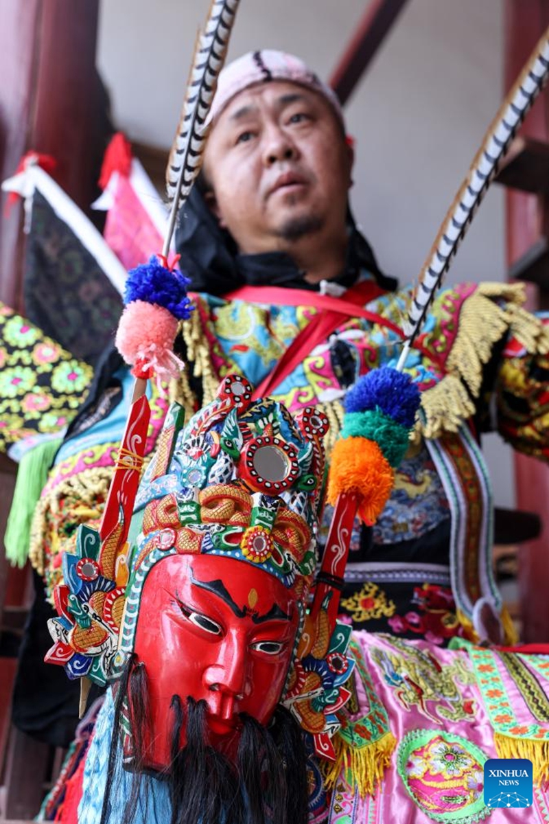 A villager makes preparations for a Dixi opera performance in Jiuxi Village of Daxiqiao Town, Anshun City, southwest China's Guizhou Province, July 24, 2024. Photo: Xinhua