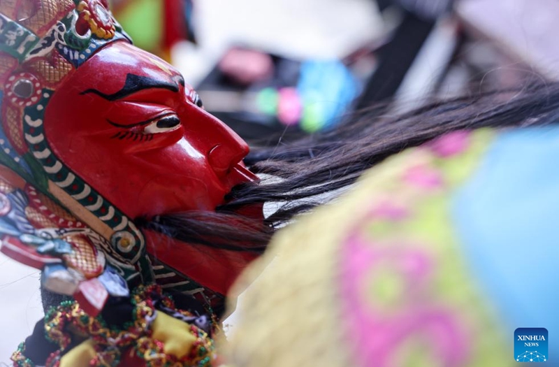 A villager makes preparations for a Dixi opera performance in Jiuxi Village of Daxiqiao Town, Anshun City, southwest China's Guizhou Province, July 24, 2024. Photo: Xinhua