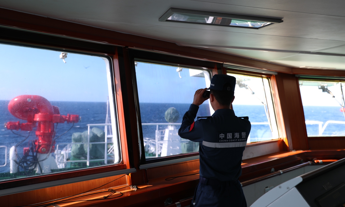 In the waters of Huangyan Dao, a CCG <em>Wanshan</em> Vessel officer is on duty in the cockpit. Photo: Courtesy of China Coast Guard