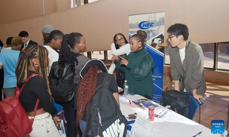 Local graduates talk with staff members of a Chinese company at a job fair held in University of Botswana in Gaborone, Botswana, Aug. 9, 2024. Eight Chinese companies held a job fair in Botswana on Friday, attracting about 200 applicants from various universities. Photo: Xinhua