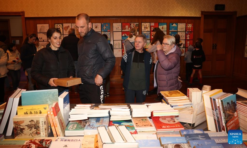 People visit a book exhibition, which coincides with the Panda Meets Kiwi Youth International Art Exhibition, in Waipa District, New Zealand, Aug. 10, 2024. Photo: Xinhua