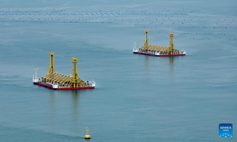 An aerial drone photo taken on Aug. 9, 2024 shows deep-sea aquaculture platforms in Lianjiang County of Fuzhou, southeast China's Fujian Province. Lianjiang County has been actively exploring and supporting the construction of deep-sea aquaculture platforms. Eleven platforms have been put into use here since 2018 and the annual output of high-quality fish reaches nearly 2,000 tonnes. Photo: Xinhua