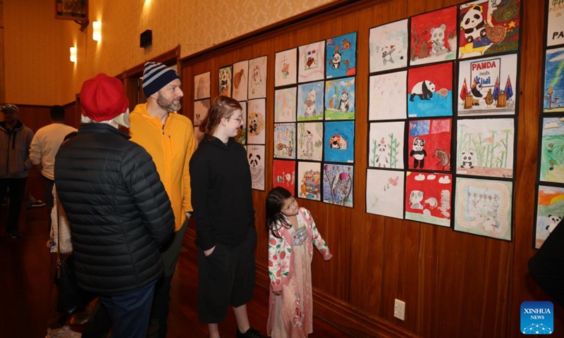 People visit a book exhibition, which coincides with the Panda Meets Kiwi Youth International Art Exhibition, in Waipa District, New Zealand, Aug. 10, 2024. Photo: Xinhua