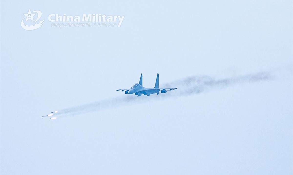 A fighter jet attached to an aviation brigade with the air force under PLA Northern Theater Command fires rockets at ground target during a live-fire training exercise on June 14, 2024. (eng.chinamil.com.cn/Photo by Wang Hao)