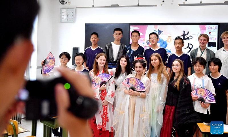 Chinese and American teachers and students pose for a group photo during a cultural event at Shijiazhuang Foreign Language School in Shijiazhuang, north China's Hebei Province, Aug. 10, 2024. A delegation of middle school students and teachers from US state Iowa took part in a cultural event here on the occasion of the Qixi Festival, also known as Chinese Valentine's Day. Photo: Xinhua