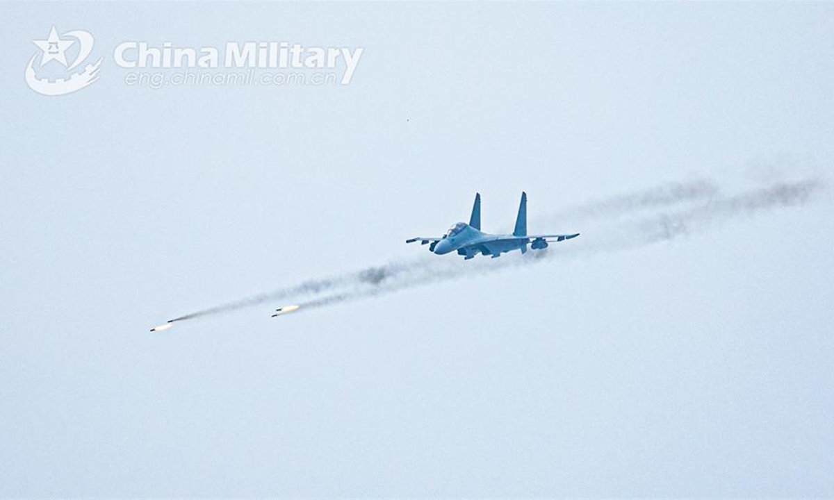 A fighter jet attached to an aviation brigade with the air force under PLA Northern Theater Command fires rockets at ground target during a live-fire training exercise on June 14, 2024. (eng.chinamil.com.cn/Photo by Wang Hao)