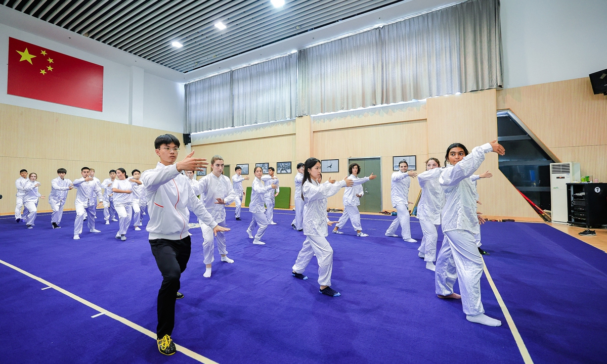 US and Chinese students practice tai chi together at the Sports Center of Nanjing Agricultural University in Nanjing, Jiangsu Province, earlier in August. Photo: Courtesy of Duke Kunshan University