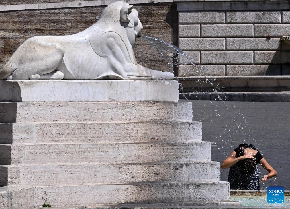 A woman cools off at Fontana dei Leoni during a heatwave in Rome, Italy, on Aug. 14, 2024. (Photo: Xinhua)