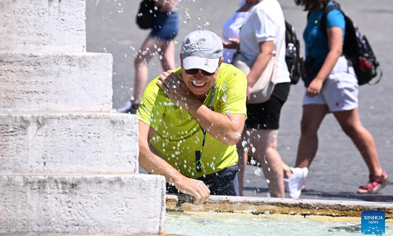 A man cools off at Fontana dei Leoni during a heatwave in Rome, Italy, on Aug. 14, 2024. (Photo: Xinhua)