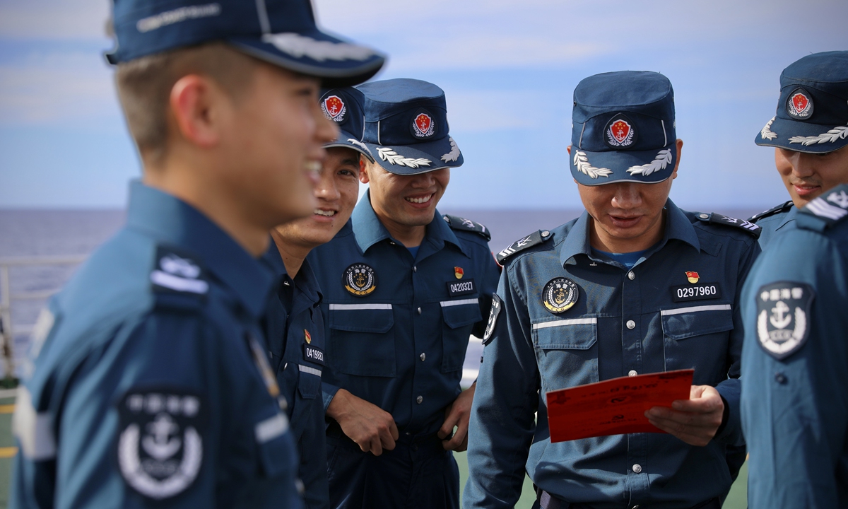 CCG officers celebrate CPC's 103rd founding anniversary on the <em>Wanshan</em>during their mission patrolling in the waters off Huangyan Dao on July 1, 2024. Photo: Lin Xiaoyi/GT