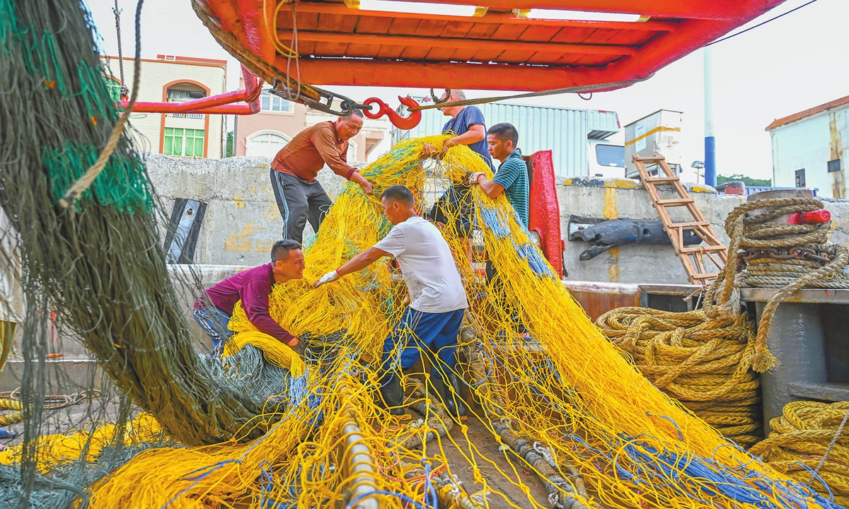 Fishermen at the Zhapo Fishing Port in Yangjiang, South China's Guangdong Province, gear up for the upcoming fishing season on August 15, 2024. With the end of the summer fishing moratorium on August 16, the fishing boats will set sail for the open seas. Photo: VCG