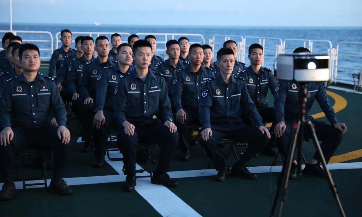 CCG officers watch a movie on the deck of the <em>Wanshan</em> on patrol in the waters of  Huangyan Dao, on June 28, 2024. 2024. Photo: Lin Xiaoyi/GT