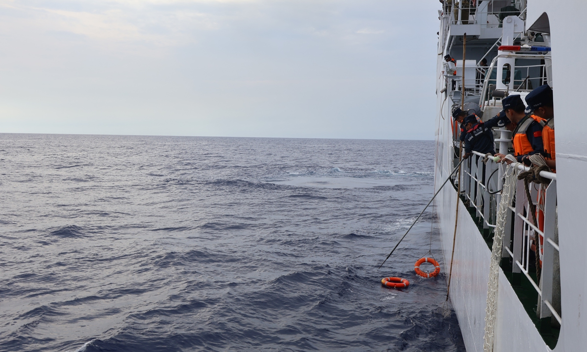 CCG officers of the <em>Wanshan</em> take part in a rescue exercise in waters off Huangyan Dao on July 7, 2024. Photo: Courtesy of China Coast Guard