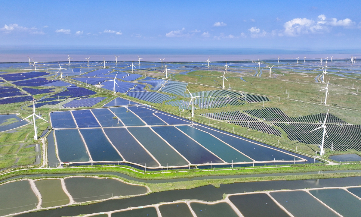 Wind turbines and photovoltaic panels in Yancheng,<strong></strong> East China's Jiangsu Province deliver reliable green energy on August 15, 2024. According to data from the National Energy Administration, as of July, China's installed renewable energy power generation capacity reached 1.65 billion kilowatts, up 25 percent year-on-year. Photo: VCG