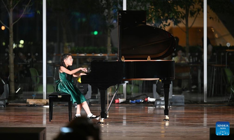 A child performs at an outdoor concert in the Tianjin Juilliard School in north China's Tianjin, Aug. 16, 2024. The outdoor concert, which kicked off here on Friday, will last until late September this year. Photo: Xinhua