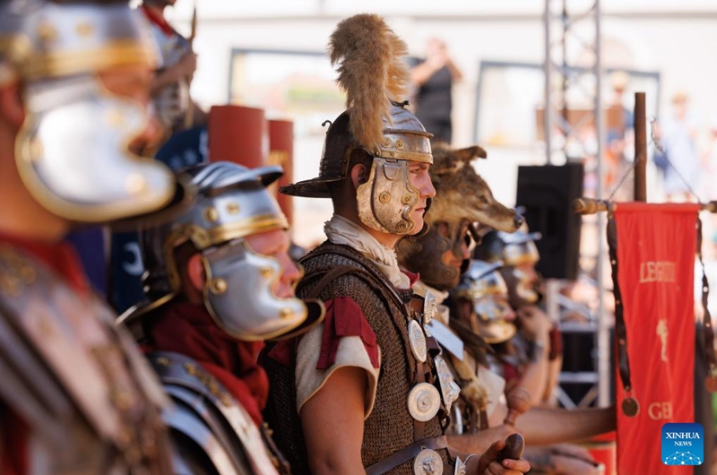 Participants dressed as Roman soldiers wait to present military skills during the Roman Games in Ptuj, Slovenia, Aug. 17, 2024. The Roman Games, one of the largest presentations of the Roman period in Slovenia, was held in Ptuj on Saturday. Photo: Xinhua