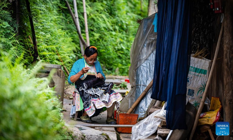 A villager makes embroidery at home in Basha Village, Congjiang County of Qiandongnan Miao and Dong Autonomous Prefecture, southwest China's Guizhou Province, Aug. 16, 2024. Photo: Xinhua