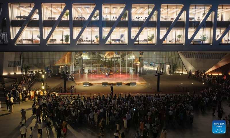 A drone photo shows people enjoying an outdoor concert at the Tianjin Juilliard School in north China's Tianjin, Aug. 16, 2024. The outdoor concert, which kicked off here on Friday, will last until late September this year. Photo: Xinhua