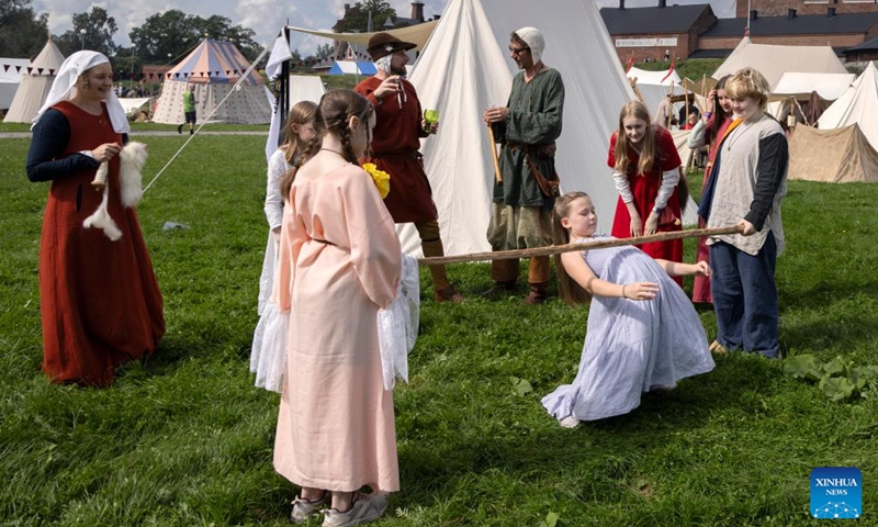 Reenactors are pictured during the Hame Medieval Festival in Hameenlinna, Finland on Aug. 17, 2024. The southern Finnish city of Hameenlinna hosted the Hame Medieval Festival, one of Finland's largest historical festivals, on the picturesque lakeside meadow beside Hame Castle from Aug. 16 to 18. Photo: Xinhua