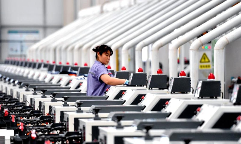 A worker works at an intelligent digital workshop of a fastener manufacturing company in Yongnian District of Handan, north China's Hebei Province, Aug. 16, 2024. Yongnian District in Handan City, north China's Hebei Province, houses over 200 fastener companies. In 2023, these companies there produced six million tons of fasteners, accounting 58 percent of the national market, and their goods found markets in over 110 countries and regions. Photo: Xinhua