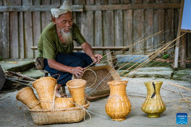 A villager makes bamboo baskets in Basha Village, Congjiang County of Qiandongnan Miao and Dong Autonomous Prefecture, southwest China's Guizhou Province, Aug. 16, 2024. Photo: Xinhua