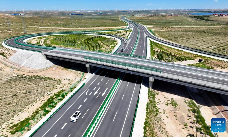 This aerial drone photo taken on Aug. 16, 2024 shows vehicles running along the Yinchuan-Kunming highway in northwest China's Ningxia Hui Autonomous Region. A section of the Yinchuan-Kunming highway within Ningxia, from Taiyangshan development zone to Pengyang, was completed and opened to traffic on Friday, marking the full opening of the Yinchuan-Kunming highway. The highway linking Yinchuan of northwest China's Ningxia Hui Autonomous Region and Kunming of southwest China's Yunnan Province, spans 2322 kilometers. Photo: Xinhua