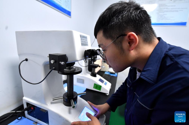 A staff member tests the hardness of fastener products at a lab in Yongnian District of Handan, north China's Hebei Province, Aug. 16, 2024. Yongnian District in Handan City, north China's Hebei Province, houses over 200 fastener companies. In 2023, these companies there produced six million tons of fasteners, accounting 58 percent of the national market, and their goods found markets in over 110 countries and regions. Photo: Xinhua