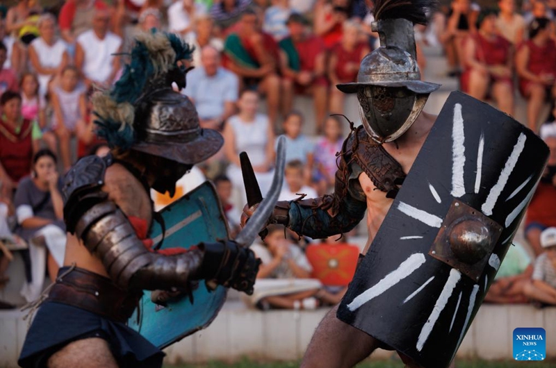 Participants dressed as gladiators show their battle skills during the Roman Games at the amphitheater in Ptuj, Slovenia, Aug. 17, 2024. The Roman Games, one of the largest presentations of the Roman period in Slovenia, was held in Ptuj on Saturday. Photo: Xinhua