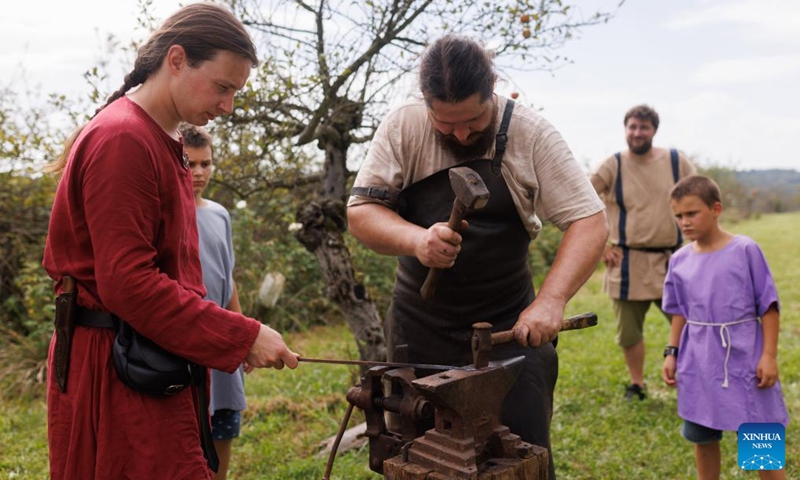 A participant dressed in Roman costume represents a blacksmith profession during the Roman Games in Ptuj, Slovenia, Aug. 17, 2024. The Roman Games, one of the largest presentations of the Roman period in Slovenia, was held in Ptuj on Saturday. Photo: Xinhua