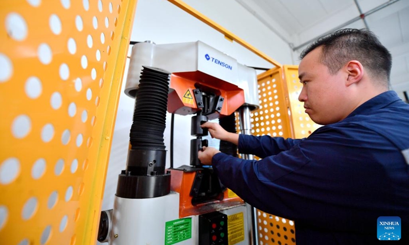 A staff member tests the strength of fastener products at a lab in Yongnian District of Handan, north China's Hebei Province, Aug. 16, 2024. Yongnian District in Handan City, north China's Hebei Province, houses over 200 fastener companies. In 2023, these companies there produced six million tons of fasteners, accounting 58 percent of the national market, and their goods found markets in over 110 countries and regions. Photo: Xinhua