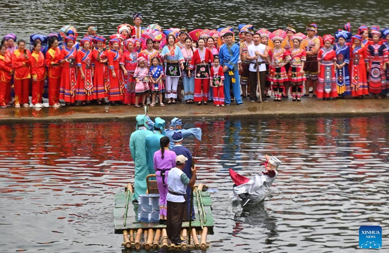 Villagers stage an outdoor performance in Wangdong Township of Rongshui Miao Autonomous County in south China's Guangxi Zhuang Autonomous Region, Aug. 18, 2024. In recent years, Wangdong Township has leveraged its abundant water resources to promote rural vitalization. Supported by the pairing assistance from Lianjiang City in Guangdong Province, the township has organized water sports competitions, mountain song duets, and activities under the theme of intangible cultural heritage in schools. These initiatives aim to build a water culture brand and advance the development of ethnic cultural tourism. Photo: Xinhua