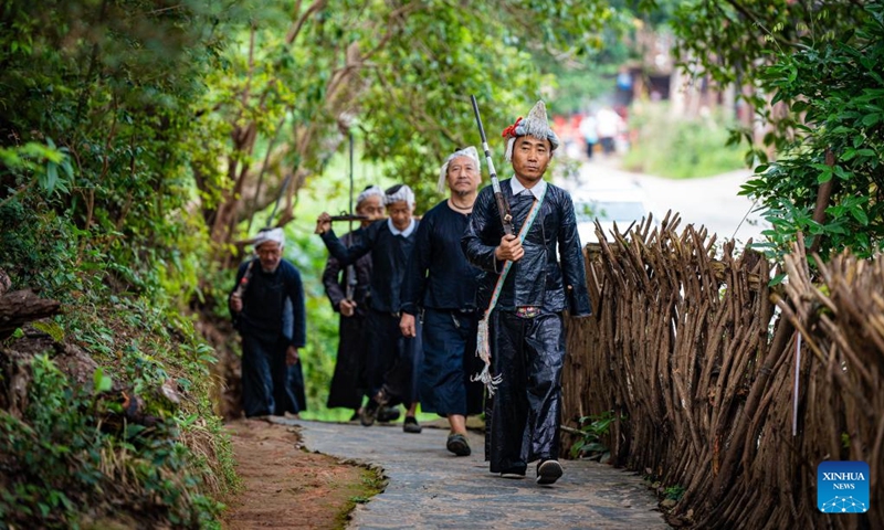 Villagers are on their way to a performance in Basha Village, Congjiang County of Qiandongnan Miao and Dong Autonomous Prefecture, southwest China's Guizhou Province, Aug. 16, 2024. Photo: Xinhua