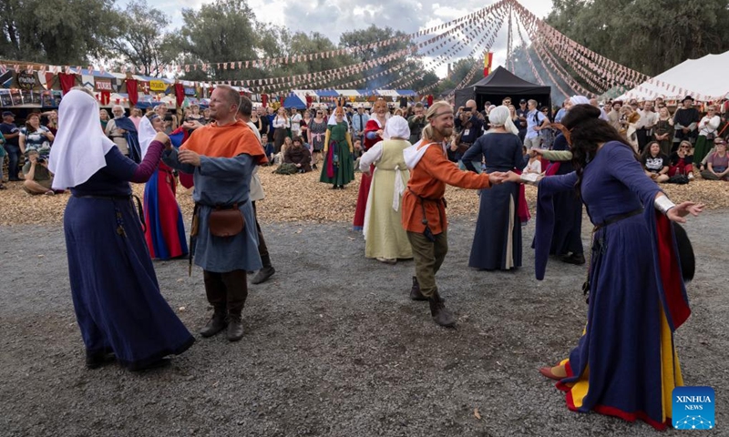 Reenactors perform medieval dances during the Hame Medieval Festival in Hameenlinna, Finland on Aug. 17, 2024. The southern Finnish city of Hameenlinna hosted the Hame Medieval Festival, one of Finland's largest historical festivals, on the picturesque lakeside meadow beside Hame Castle from Aug. 16 to 18. Photo: Xinhua